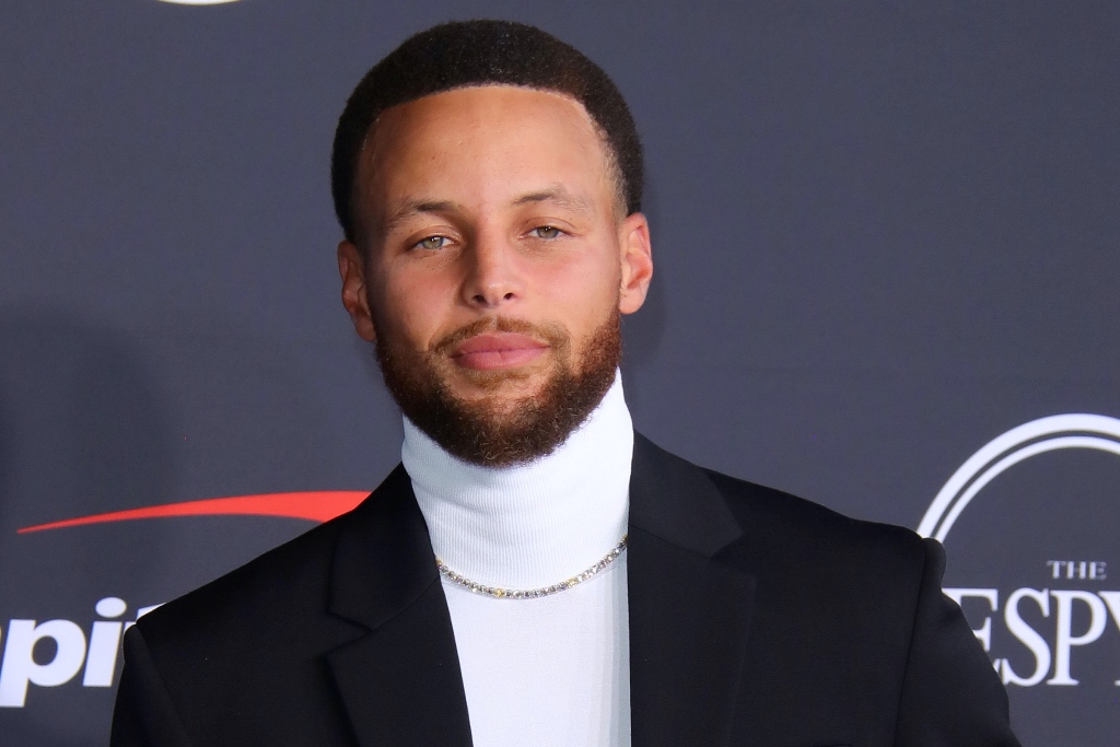 Stephen Curry Celebrates His NFT Line in Tracksuit & Chunky Sneakers – Footwear News