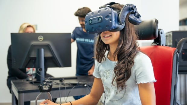New virtual reality game at IWK teaches kids to safely drive power wheelchairs | CBC News